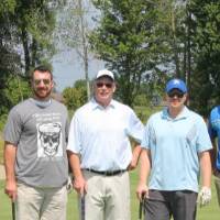 4 men by another flag